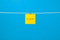 Yellow paper note on the string with text Ã¢â¬ÅASAPÃ¢â¬Â Royalty Free Stock Photo